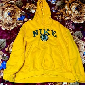 I’m selling a dark yellow Nike sweater size XL